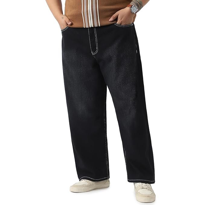 Oversized denim jeans paired with white crop top